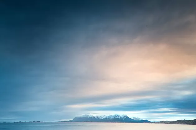 Nordic light over ocean. Photo.